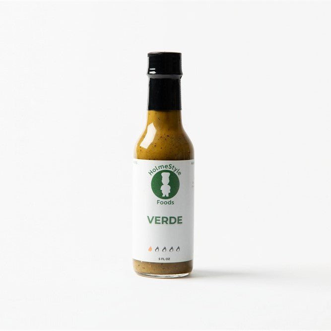Bottle of Verde sauce with a label on a white background