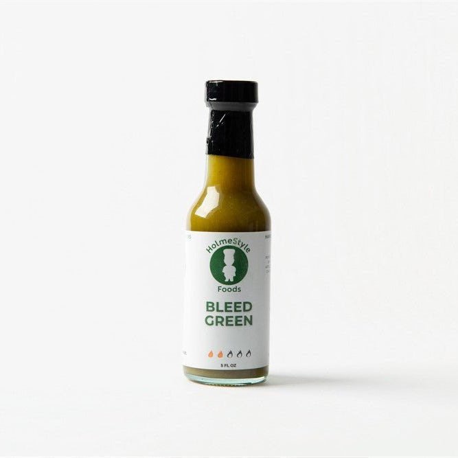 Bottle of 'Bleed Green' sauce from Holmes Style Foods on a white background