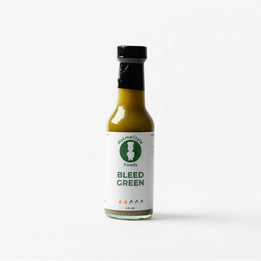 Bottle of 'Bleed Green' sauce from Holmes Style Foods on a white background