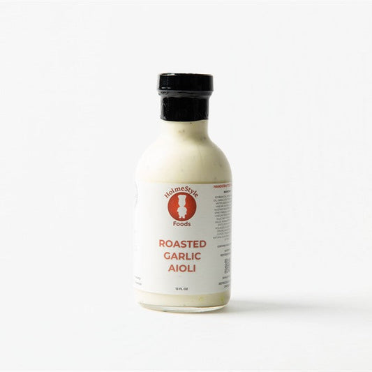 Bottle of roasted garlic aioli on a white background