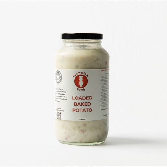 Jar of loaded baked potato salad with a label on a white background